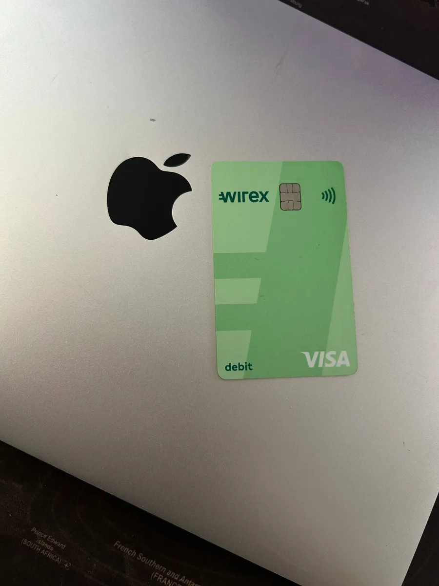 Physical Wirex Visa debit card on a MacBook